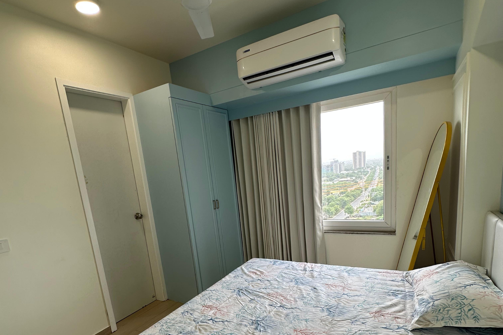Blue bedroom window view Shela KBEX